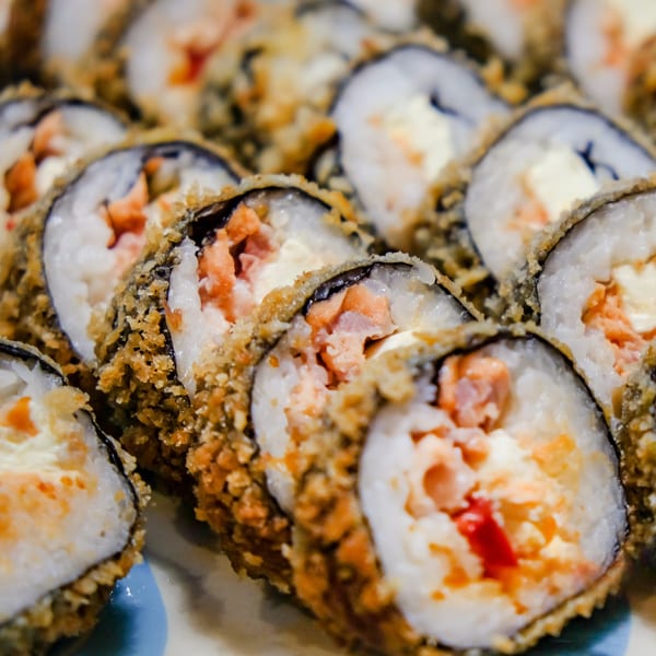 Close-up of Hot Tuna Sushi Bar and Grille's deep-fried sushi rolls with salmon and cream cheese.