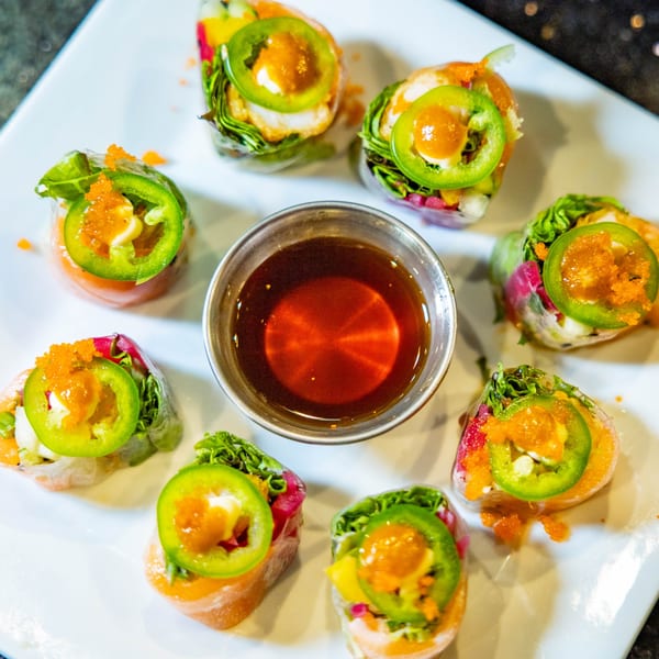 Hot Tuna Sushi Bar and Grille's fresh spring rolls with jalapeños, roe, and a side of dipping sauce.
