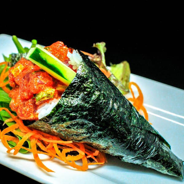 A Hot Tuna Sushi Bar and Grille hand roll with spicy tuna, rice, cucumber, and seaweed.